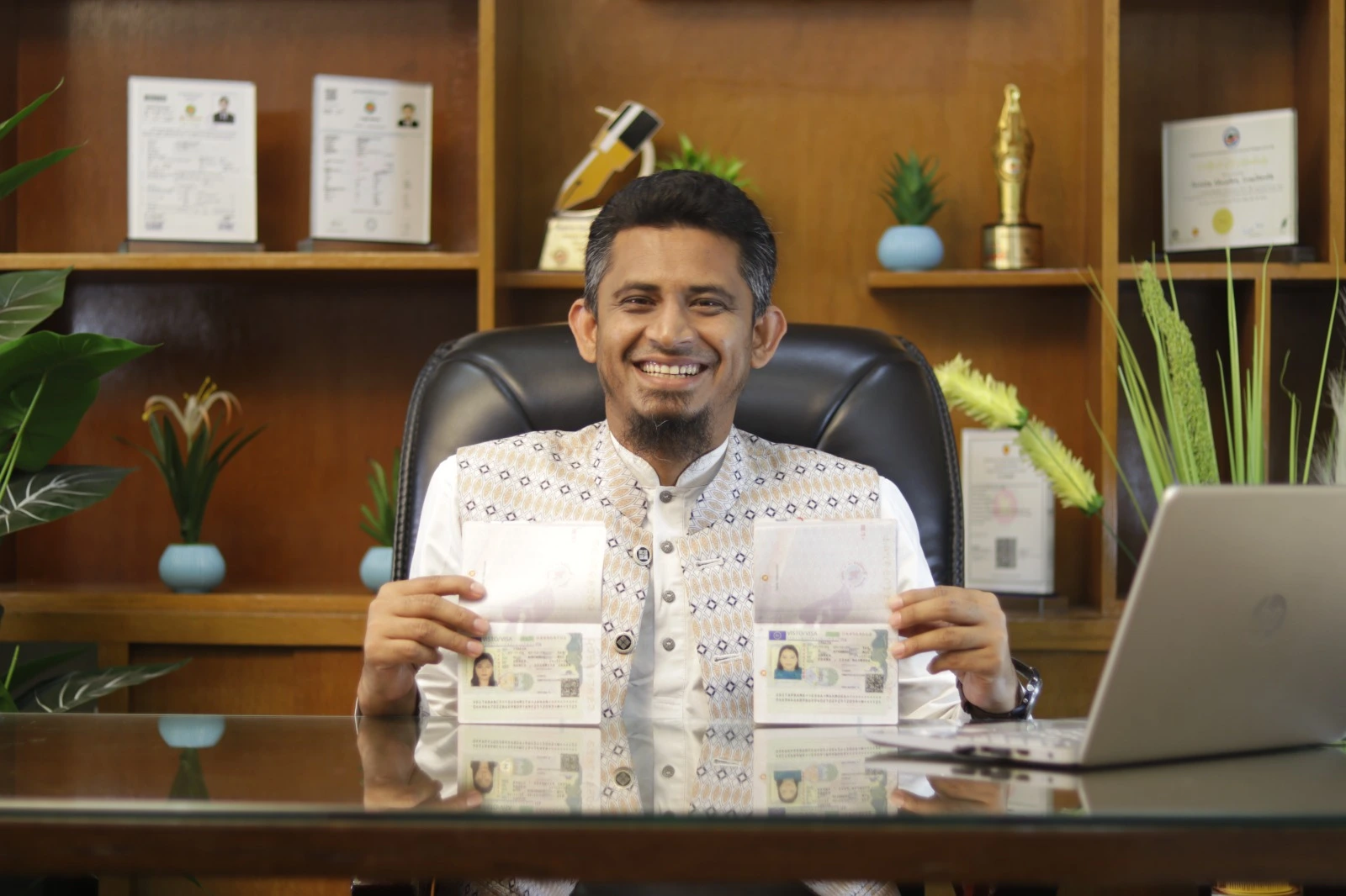 StudyinFinlandBD CEO holding 2 pasport of visa approved students